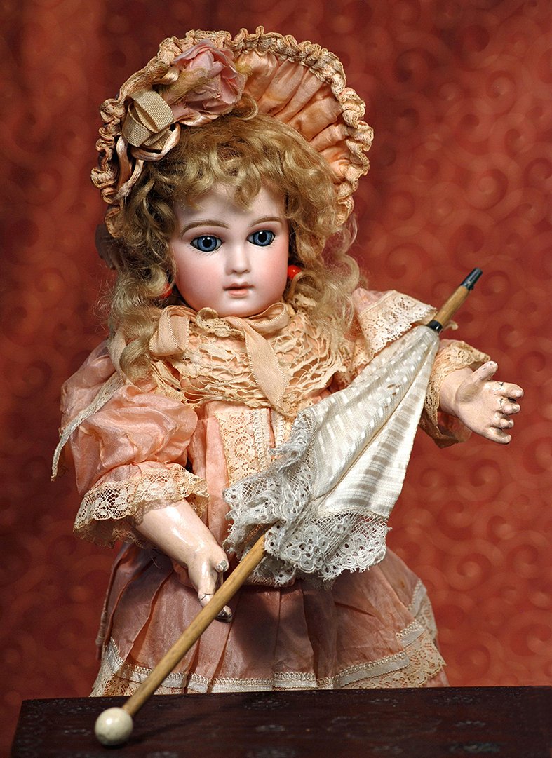 FRENCH BISQUE BLUE-EYED PREMIERE BEBE BY EMILE JUMEAU: FRENCH BISQUE BLUE-EYED PREMIERE BEBE BY EMILE JUMEAU. Marks: 7. 16”. Pressed bisque socket head, blue spiral-threaded paperweight eyes, mauve-blushed eyelids, painted lashes, eyeliner, feathered an