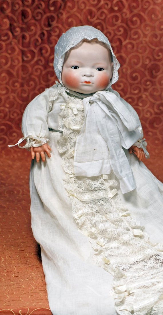 GERMAN BISQUE “BYE-LO BABY” WITH BROWN EYES: GERMAN BISQUE “BYE-LO BABY” WITH BROWN EYES. Marks: Copr. Grace S. Putnam. Height 17”; head circumference 14”. Solid-dome bisque swivel head with flange neck, molded and painted light brown ha