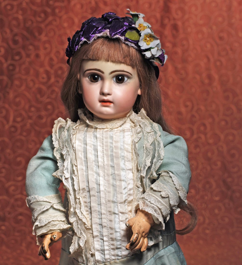 FRENCH BISQUE BEBE BY JUMEAU: FRENCH BISQUE BEBE BY JUMEAU. Marks: Depose Tete Jumea Bte SGDG 10. 23”. Bisque socket head, brown paperweight eyes, painted lashes, feathered and brushstroked brows, closed mouth, shaded and accent