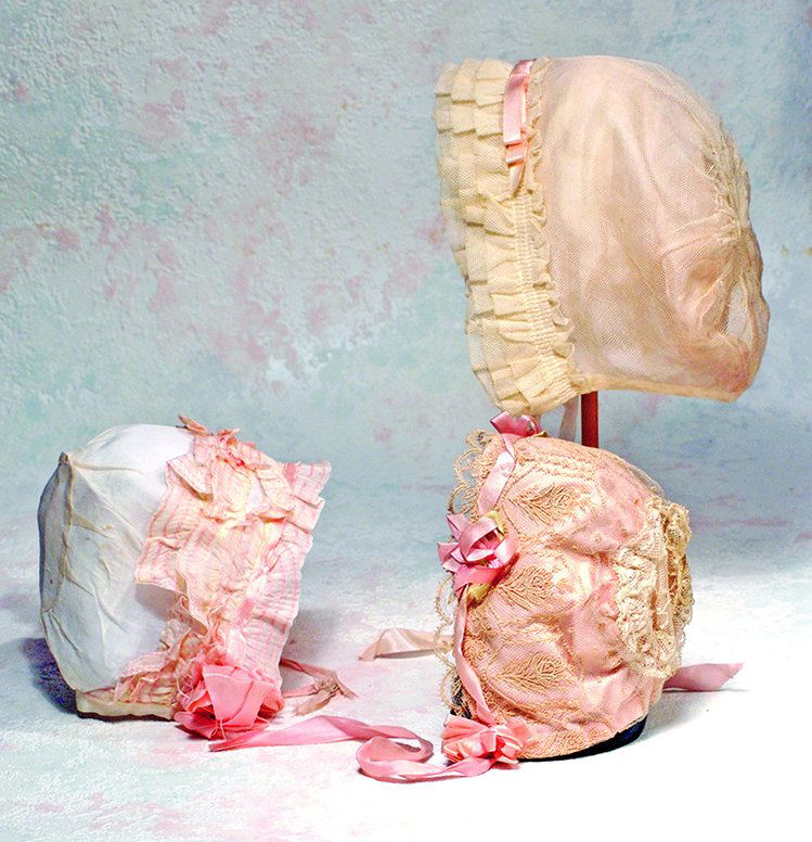 THREE DOLL BONNETS.  (1)  White cotton bonnet with four (1 of 1)