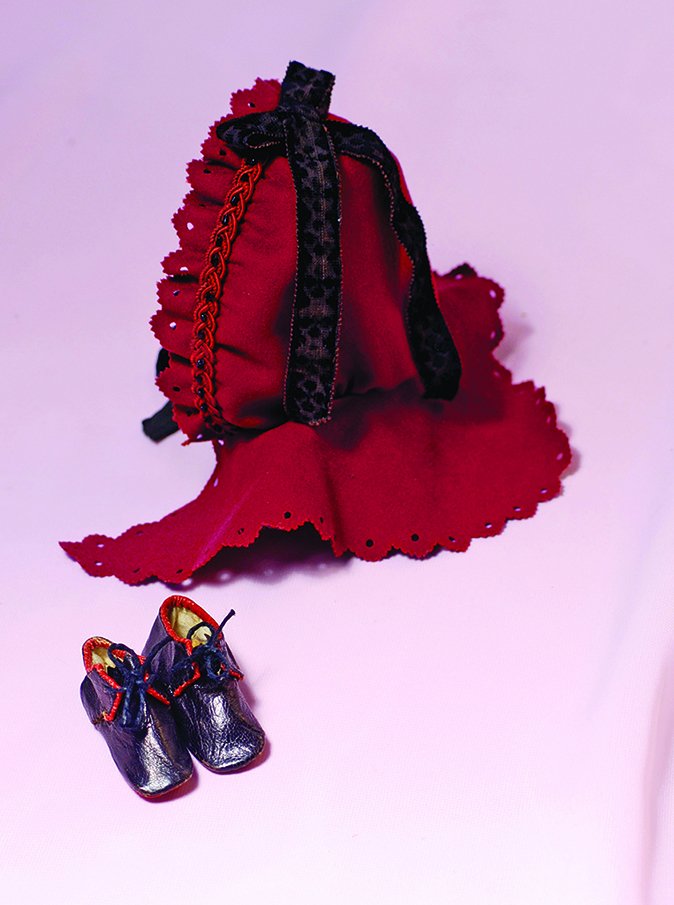 PAIR OF BLACK LEATHER ANTIQUE SLIPPERS. 2 ½” L. Soft: PAIR OF BLACK LEATHER ANTIQUE SLIPPERS. 2 ½” L. Soft black leather boots have red leather edging and soles, front tie closing, sized for slender feet. Commentary: Good condition.