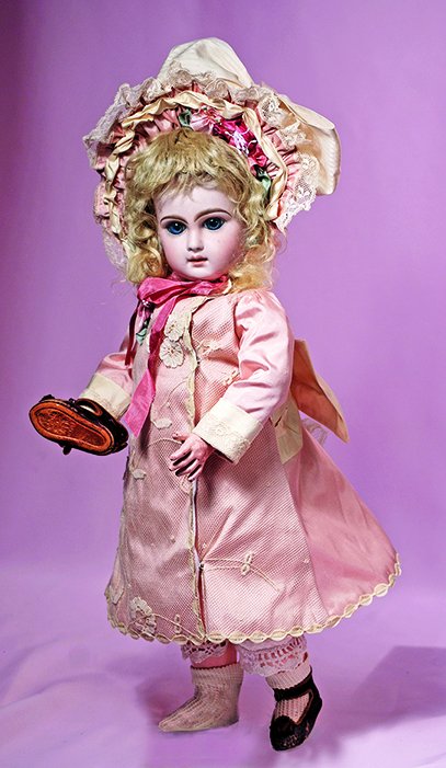 FRENCH BISQUE BEBE BY JUMEAU. Marks: 7 and red artist: FRENCH BISQUE BEBE BY JUMEAU. Marks: 7 and red artist mark. 17”. Bisque socket head, deep blue paperweight eyes, blushed eyelids, painted lashes, feathered and brushstroked brows, pierced ears, clos