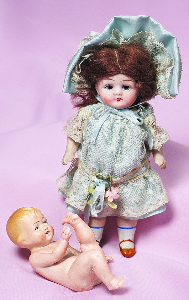 TWO ALL-BISQUE DOLLS.  (1) 5” bisque baby posed on back (1 of 1)
