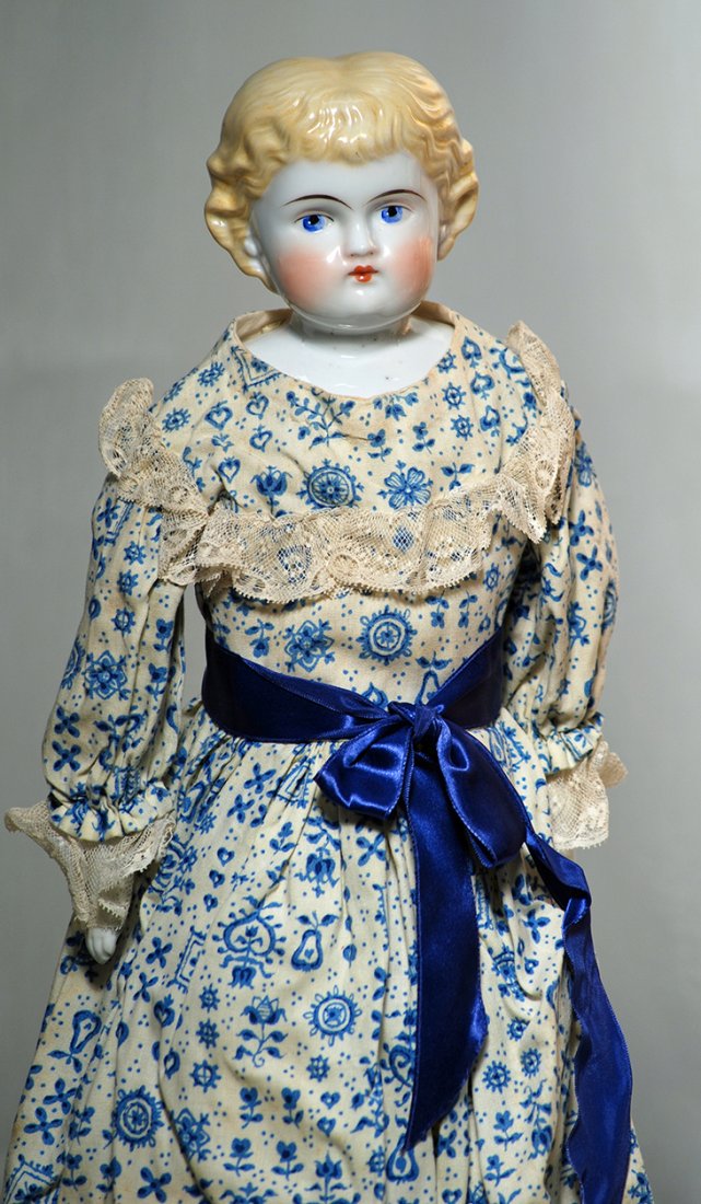 GERMAN CHINA DOLL WITH BANGS.  Marks: None.  19”. (1 of 1)