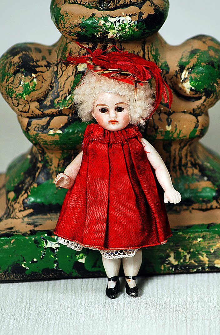 TINY GERMAN ALL-BISQUE MIGNONETTE IN ORIGINAL RED SILK (1 of 1)