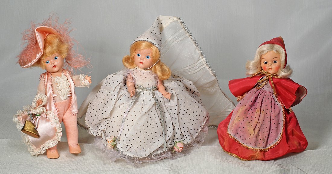 VOGUE GINNY, PAINTED EYE, CINDERELLA.: VOGUE GINNY, PAINTED EYE, CINDERELLA. 8” Hard plastic, socket head, five-piece jointed body, blonde mohair wig, original silver dotted gown with pink roses and silver braid trim, pointed hat, stiffe