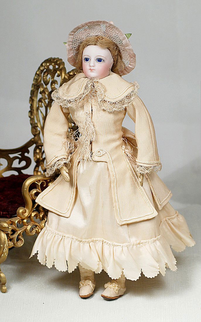 PETITE FRENCH BISQUE POUPEE.  Marks: None.  11 ”. (1 of 2)