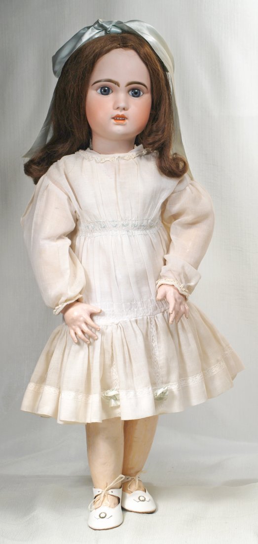 FRENCH BISQUE “1907 BEBE” BY JUMEAU. Marks: 1907./ 14: FRENCH BISQUE “1907 BEBE” BY JUMEAU. Marks: 1907./ 14 30”. Bisque socket head, blue paperweight eyes, painted lashes, feathered brows, pierced ears, open mouth, shaded and accented lips, upper t