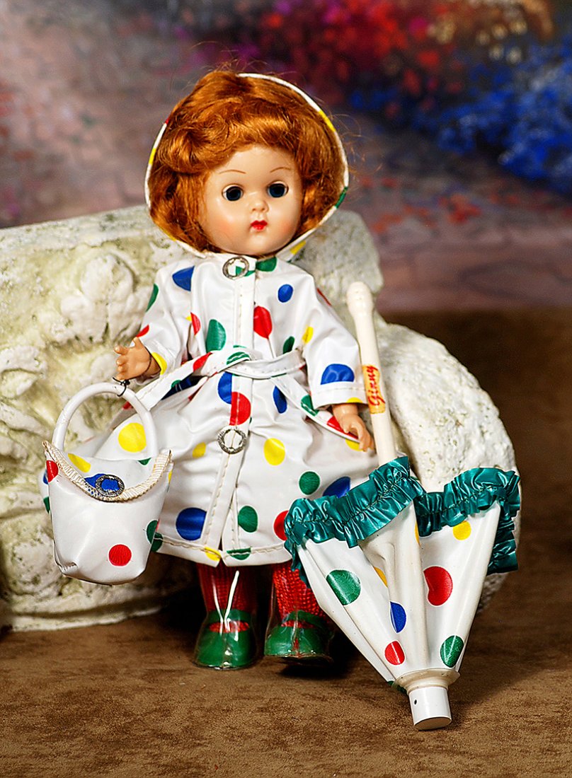 VOGUE GINNY IN RAINCOAT OUTFIT.8”.Hard plastic,: VOGUE GINNY IN RAINCOAT OUTFIT.8”.Hard plastic, straight-leg walker, blue sleep eyes, molded lashes, light auburn wig, wears hooded plastic polka-dot rain coat over white panty, matching polka-dot p