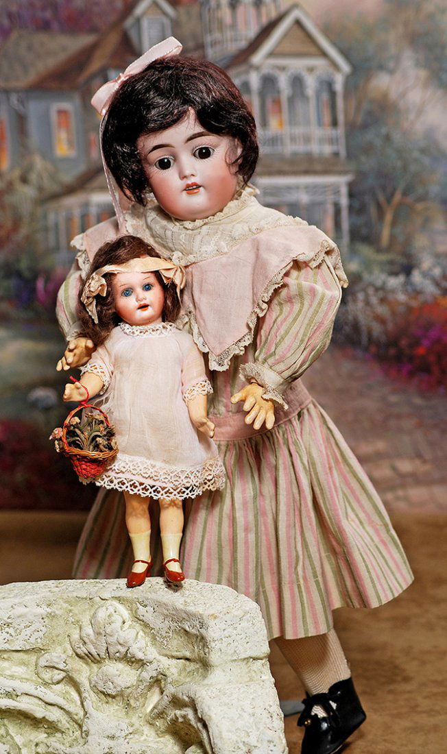 PETITE GERMAN BISQUE DOLL BY MARSEILLE.Marks: Armand: PETITE GERMAN BISQUE DOLL BY MARSEILLE.Marks: Armand Marseille A 2/0 M.7 ¾”.Bisque socket head, blue sleep eyes, painted lashes, single-stroke brows, open mouth, upper teeth, brown mohair wig, five