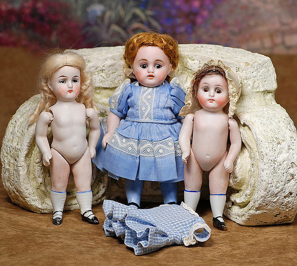 THREE GERMAN ALL-BISQUE DOLLS. Each jointed at (1 of 1)