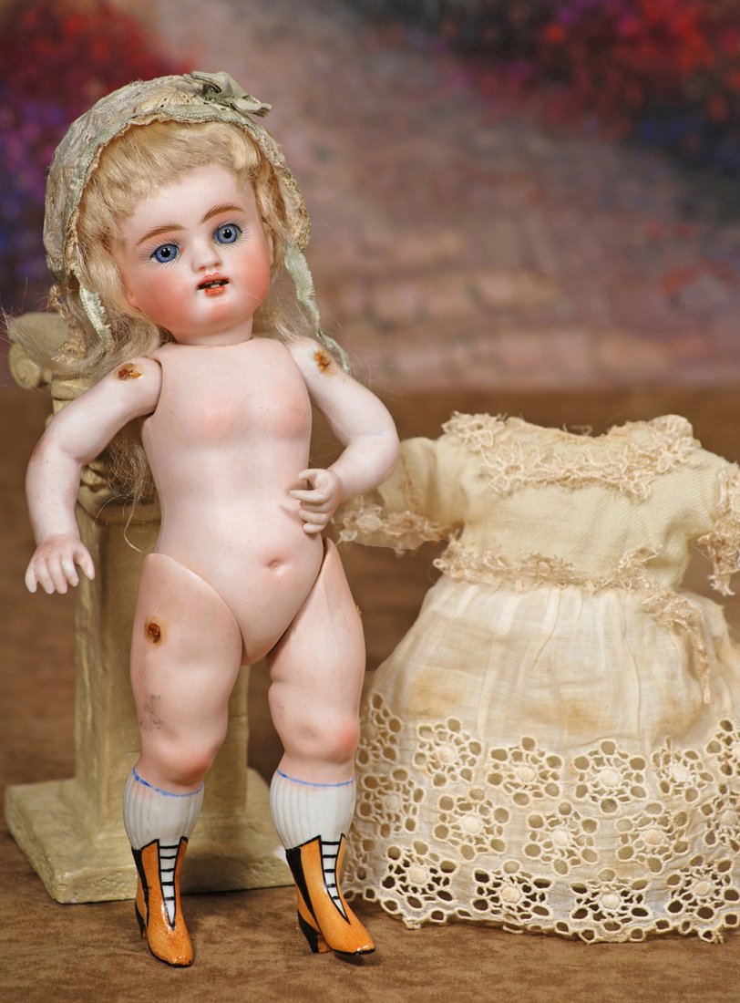 LARGE MODEL OF ALL-BISQUE “WRESTLER” BY KESTNER. Marks:: LARGE MODEL OF ALL-BISQUE “WRESTLER” BY KESTNER. Marks: 12. 9”. Bisque swivel head on jointed all-bisque body with plump modeling of legs, bent left arm, painted knee stockings and gold bootines