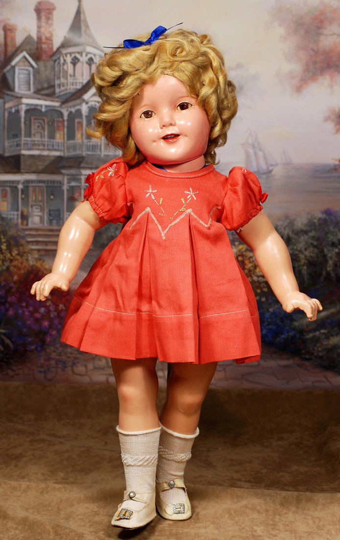 COMPOSITION, IDEAL SHIRLEY TEMPLE, IN “POOR LITTLE RICH: COMPOSITION, IDEAL SHIRLEY TEMPLE, IN “POOR LITTLE RICH GIRL” DRESS.Marks:18 Shirley Temple, © Ideal N & T.18”.Composition socket head on five-piece jointed composition body, mohair wig, sleep