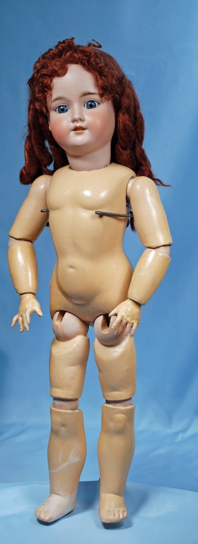 GERMAN BISQUE DOLL BY MARSEILLE.Marks:Armand Marseille: GERMAN BISQUE DOLL BY MARSEILLE.Marks:Armand Marseille 390 drgm.26”.Bisque socket head, blue sleep eyes, open mouth, pierced ears, auburn mohair wig, composition ball-jointed body with Holz-Maase st