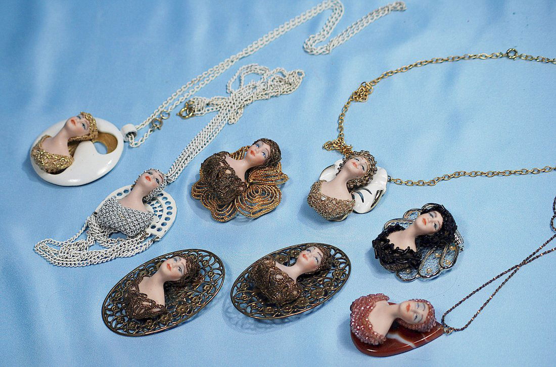 GROUP OF EIGHTBISQUE-FACE BROOCHES AND NECKLACES.Bisque (1 of 1)