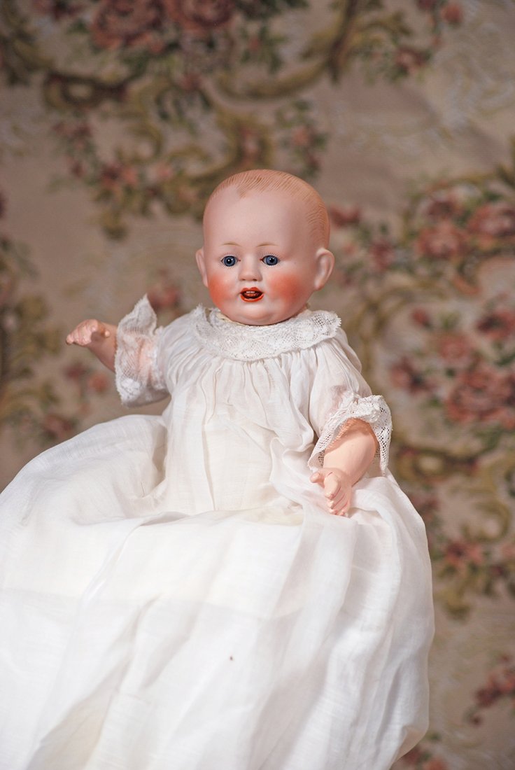 PETITE GERMAN BISQUE CHARACTER BABY BY FRANZ SCHMIDT: PETITE GERMAN BISQUE CHARACTER BABY BY FRANZ SCHMIDT. Marks: F S & Co. 1272/237. 9”. Solid-domed bisque socket head, brushstroked blonde hair, blue sleep eyes, painted lashes, feathered brows, open
