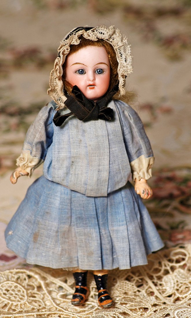 TINY GERMAN BISQUE DOLL WITH WALKER BODY BY KAMMER &: TINY GERMAN BISQUE DOLL WITH WALKER BODY BY KAMMER & REINHARDT. Marks: K * R/S & H. 6 ½”. Bisque socket head, blue sleep eyes, painted lashes, tapered brows, open mouth, upper teeth, original brown