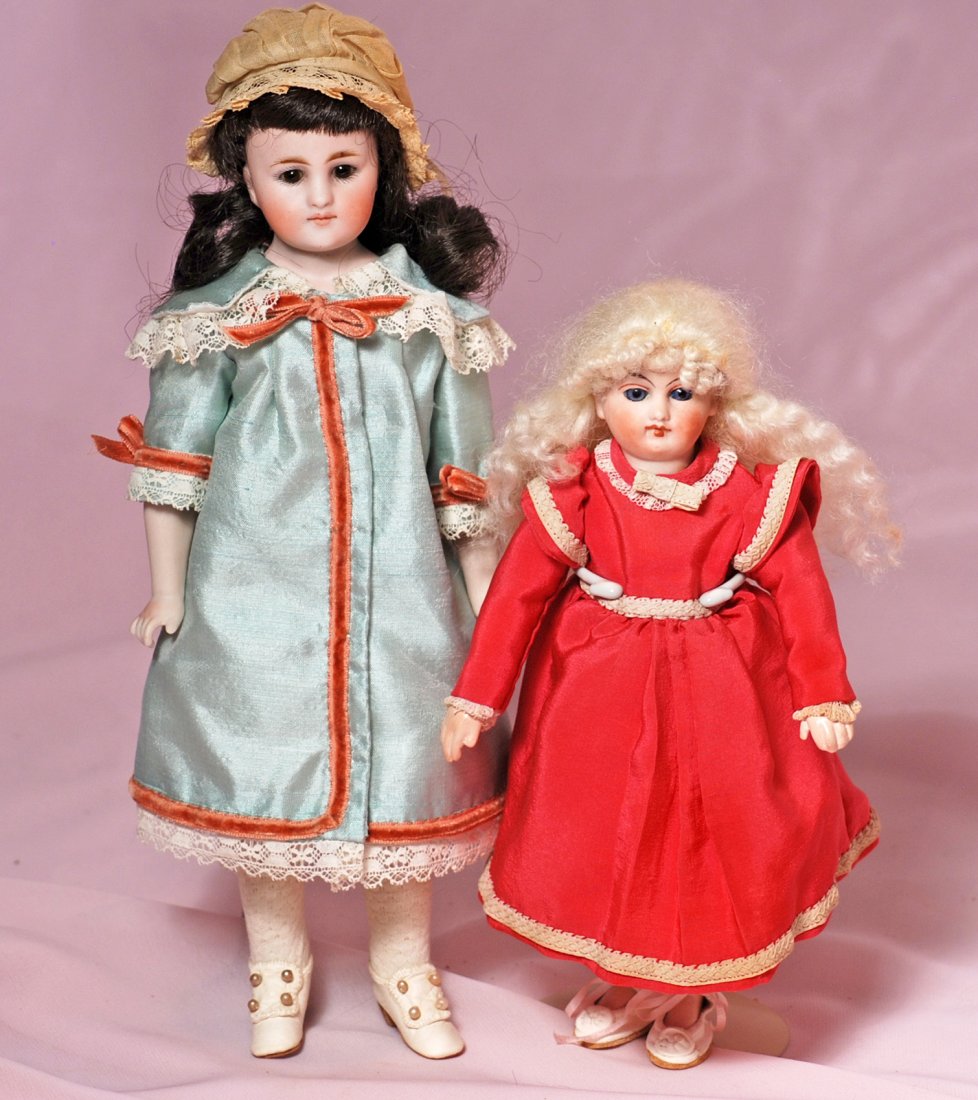 TWO GERMAN CLOSED-MOUTH SMALL DOLLS (1 of 2)