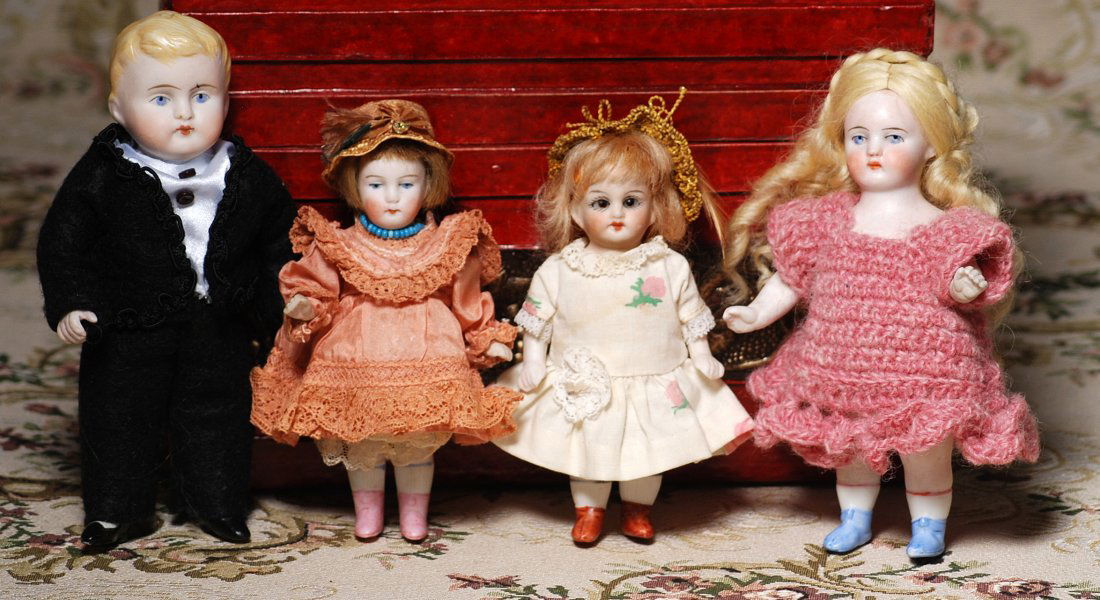 FOUR GERMAN ALL-BISQUE DOLLS. (1 of 1)
