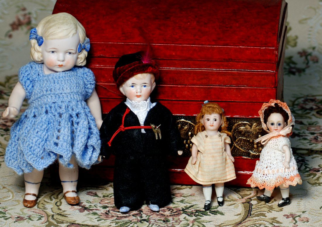 FOUR GERMAN ALL-BISQUE DOLLS. (1 of 1)