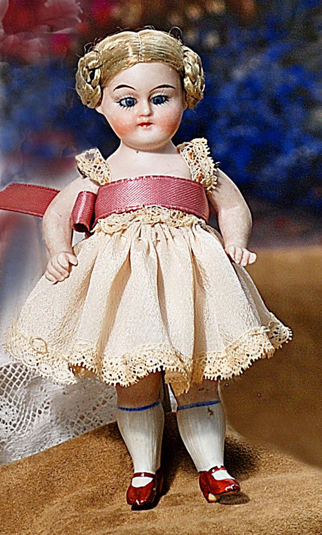TINY GERMAN ALL-BISQUE DOLL WITH GLASS EYES. (1 of 1)