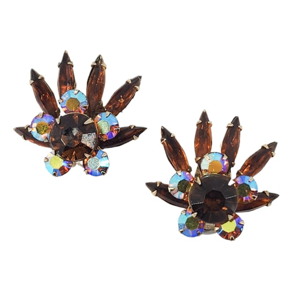 Vintage Rootbeer Navette & Aurora Borealis Rhinestone Clip Earrings: Vintage Rootbeer Navette & Aurora Borealis Rhinestone Clip Earrings. Gold tone with prong set rootbeer/topaz navettes and AB rhinestones. 1.25 x 1.25". Unmarked/unsigned. No missing stones.