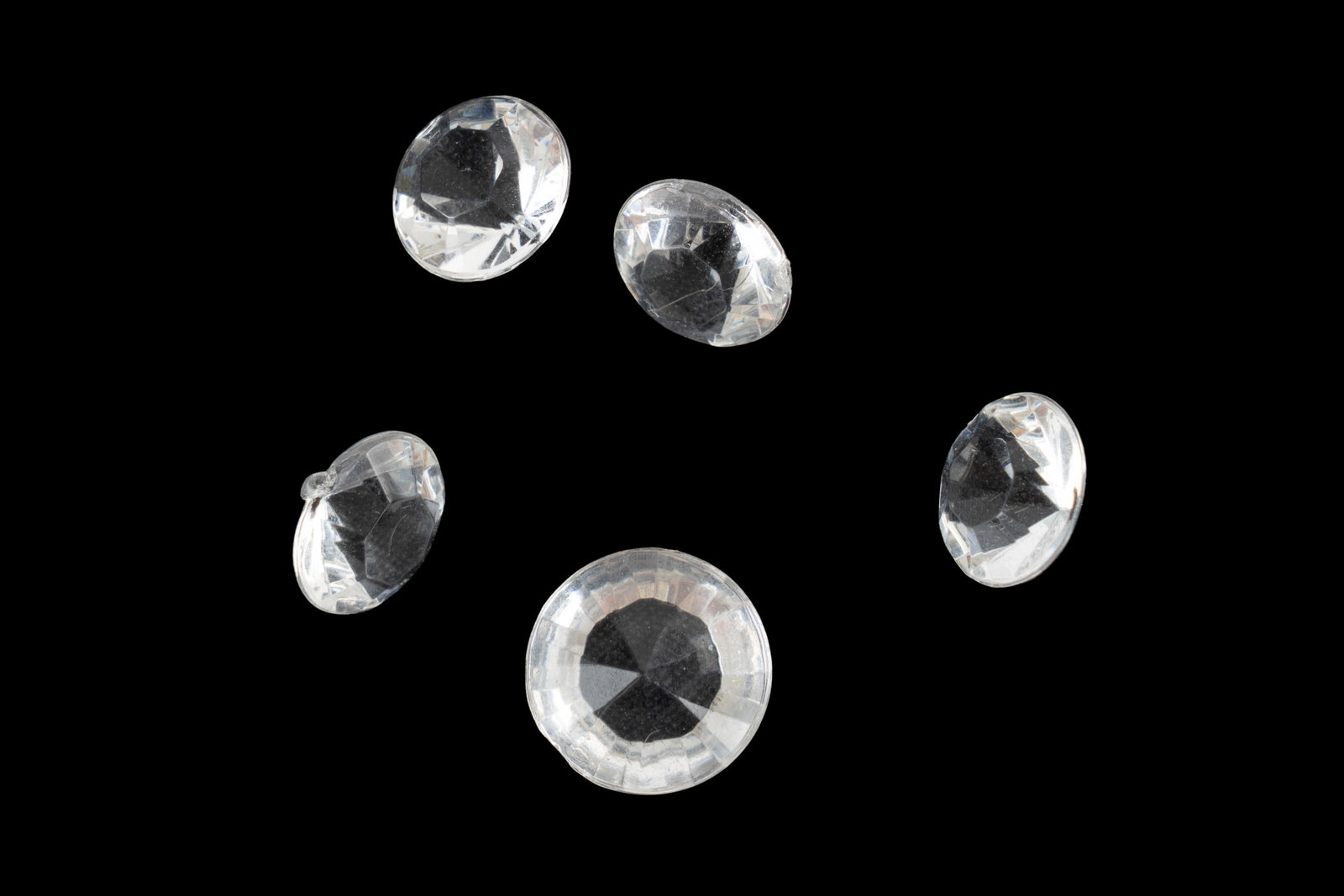 "Game of Thrones" Faux Cut Diamonds: A set of five clear faux cut diamonds from the fantasy series "Game of Thrones" (HBO, 2013). These diamonds were used by Varys to bribe Shae to sail away from Westeros, central to the series' politica