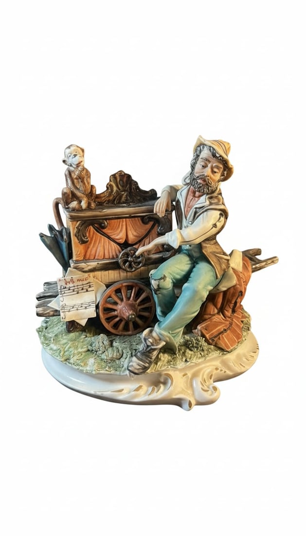 Capodimonte Porcelain Figurine "The Ploughman": This is a Capodimonte porcelain figurine depicting a ploughman resting with his cart and horse. The piece is mounted on a wooden base and features intricate detailing in the figures, clothing, and sur