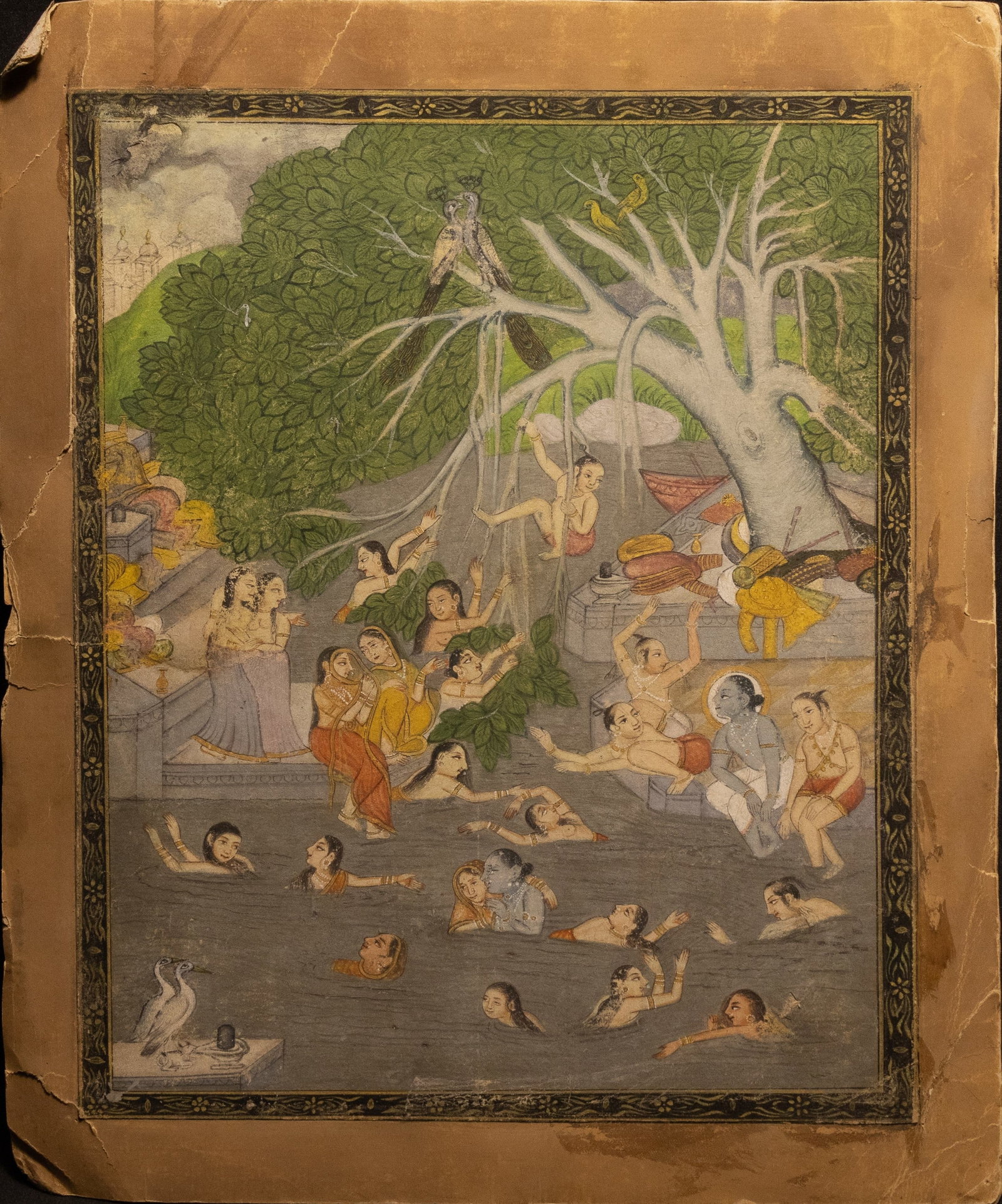 An Indian Painting of Jala-Krida ? Krishna?s Water Sport, 20th Century.: A vibrant Indian painting depicting the playful scene of Jala-Krida, where Krishna and the Gopis engage in joyous water games beneath a sprawling, leafy tree. The composition is filled with animated f