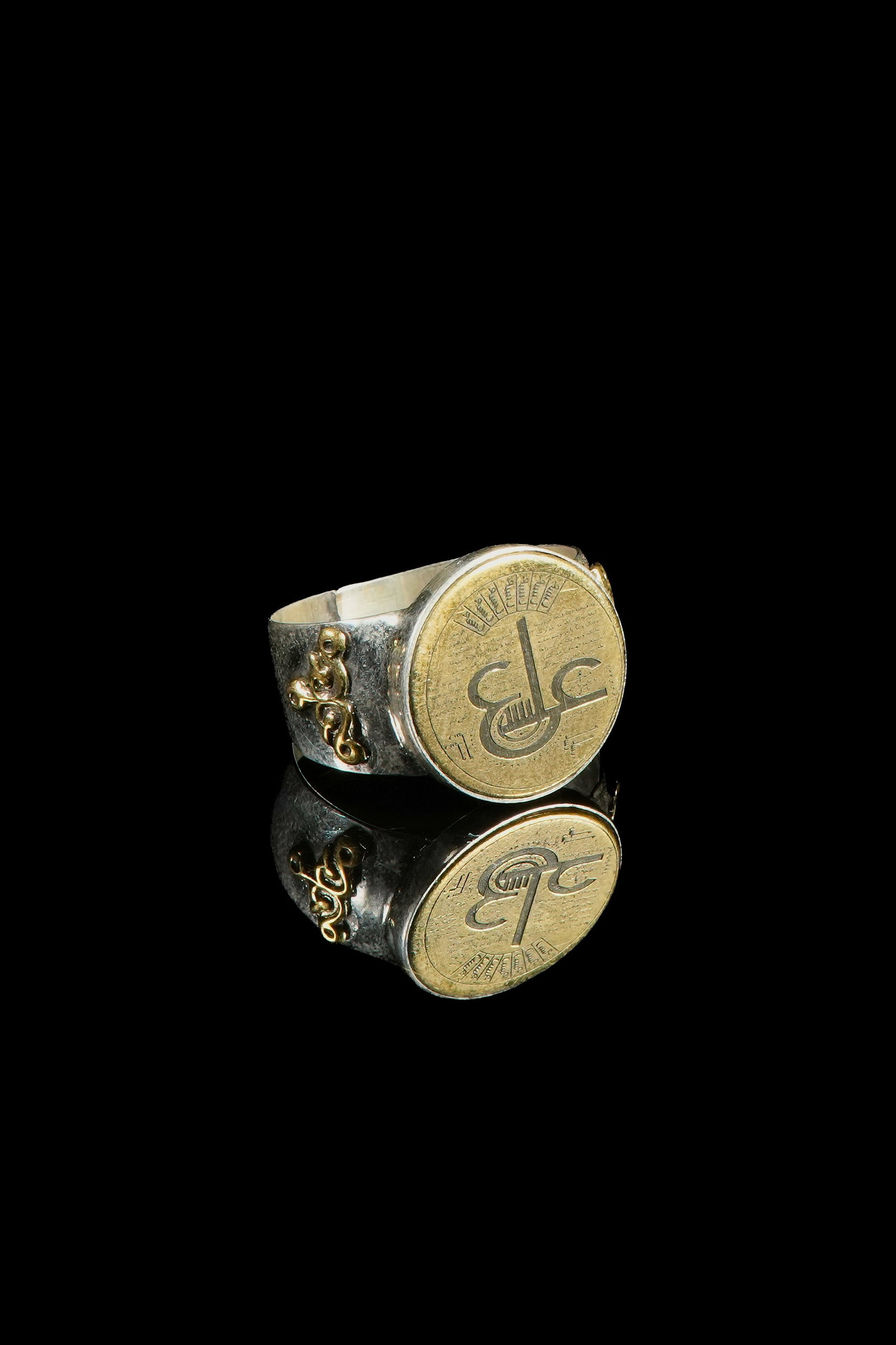 An Islamic Silver Ring with a Gilt Roundel Inscribed Ã¢â‚¬ï¿½AliÃ¢â‚¬â„¢ (1 of 3)