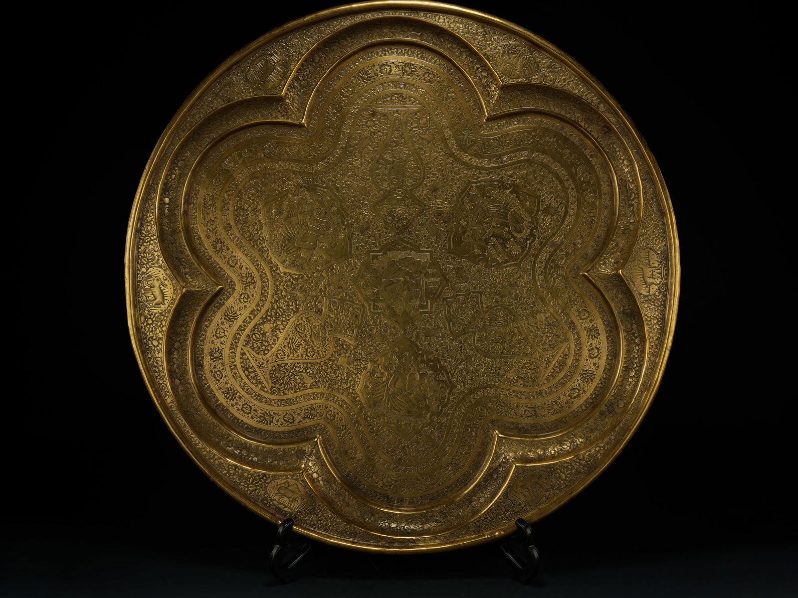 A Qajar Brass Charger with Figural and Courtly Scenes, 19th-20th Century. (1 of 2)