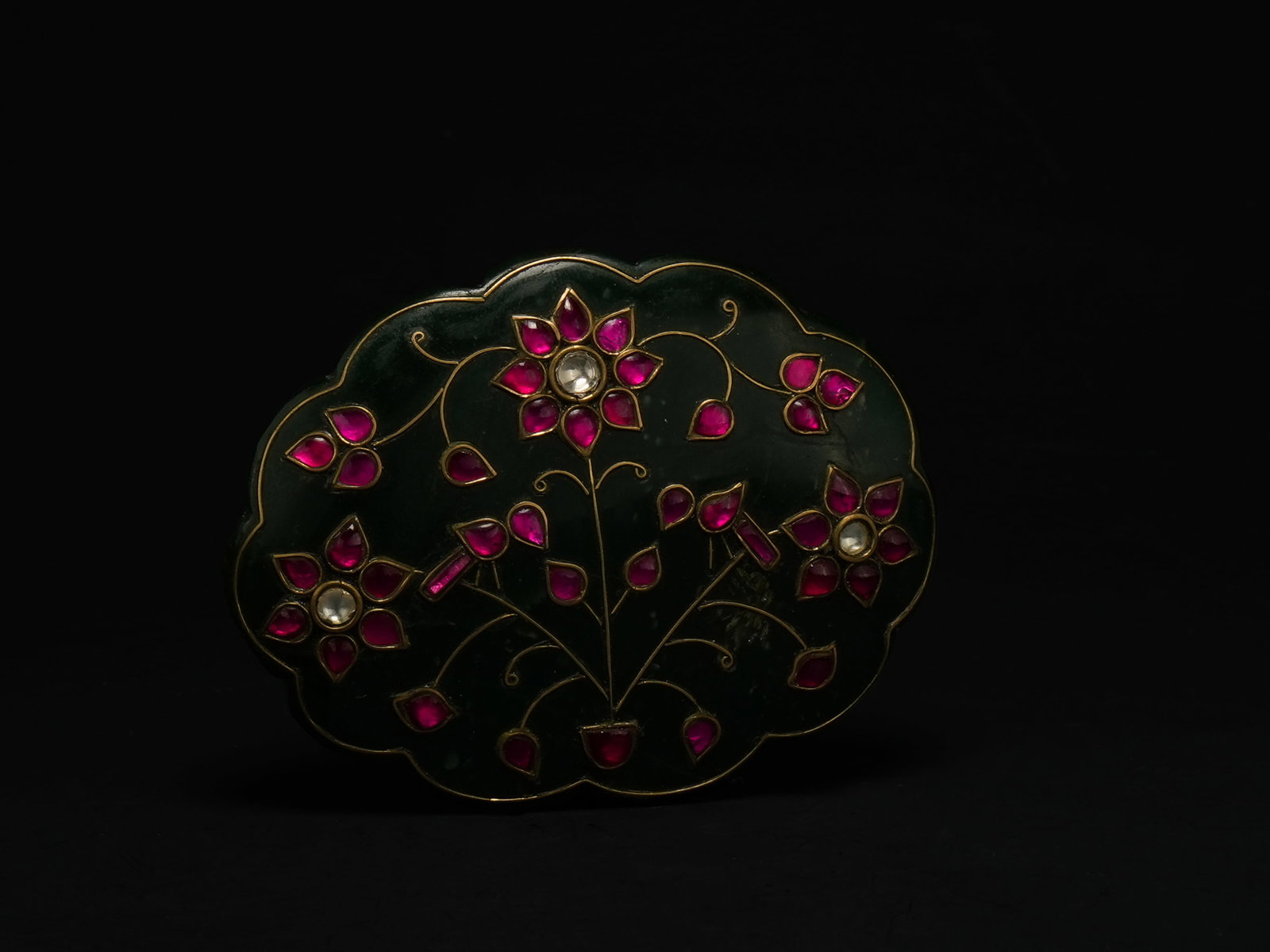 A Mughal Jade Floral Plaque Inlaid with Ruby-Coloured Stones. (1 of 2)