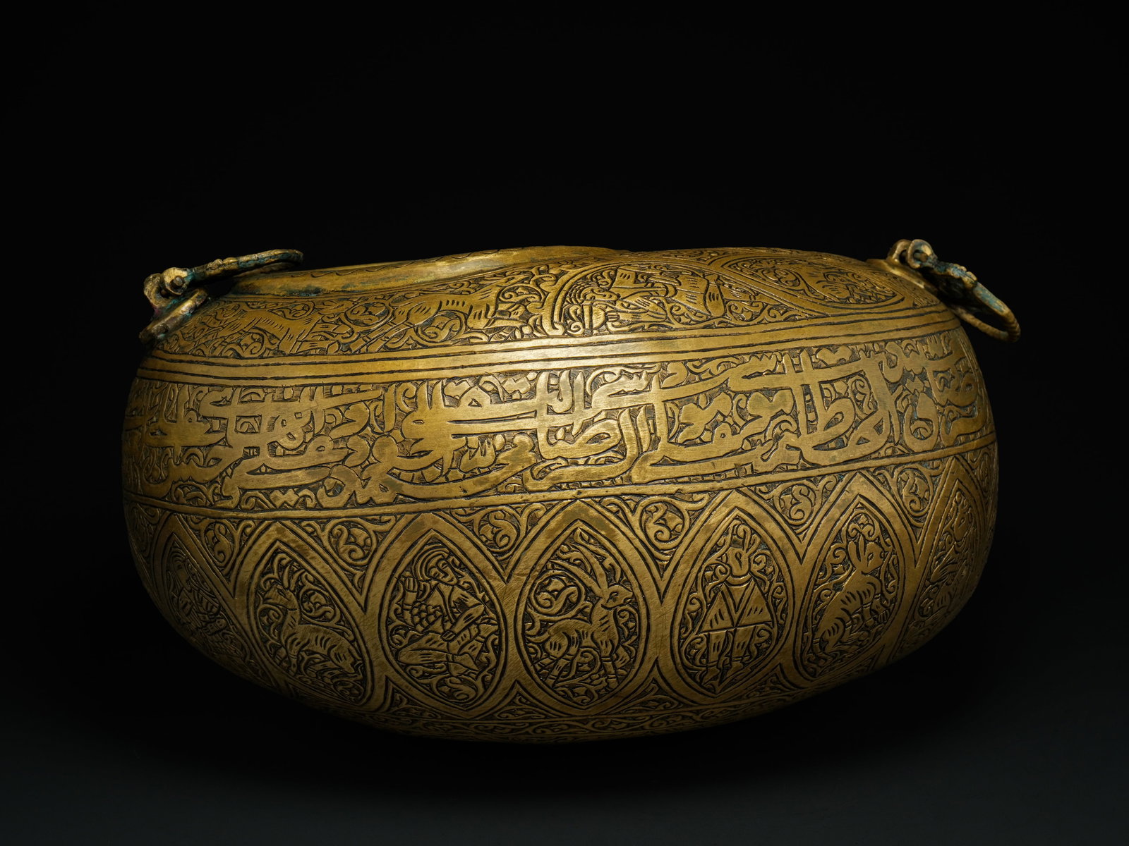 A Qajar Brass Kashkul Beggar's Bowl with Figural and Calligraphic Decoration. (1 of 6)