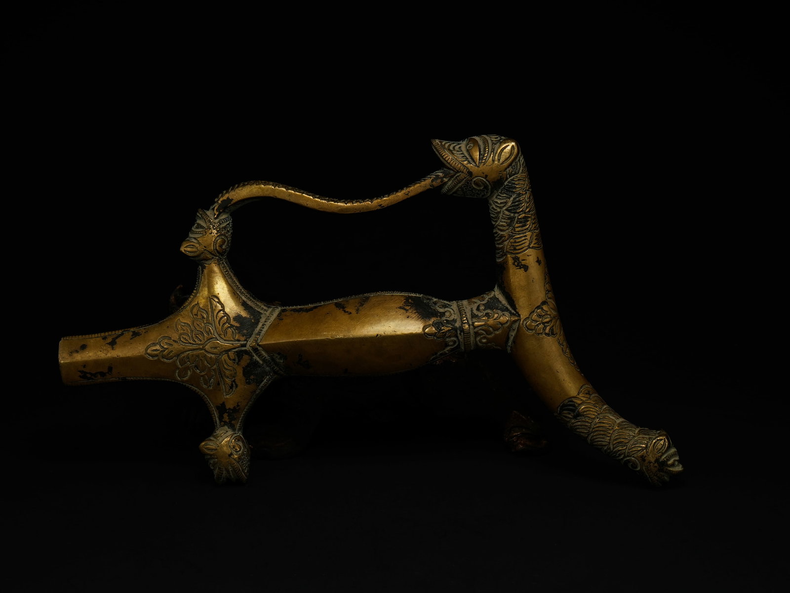 An Indian Mughal-Style Brass Dagger Handle with Zoomorphic Terminal, 20th Century. (1 of 2)
