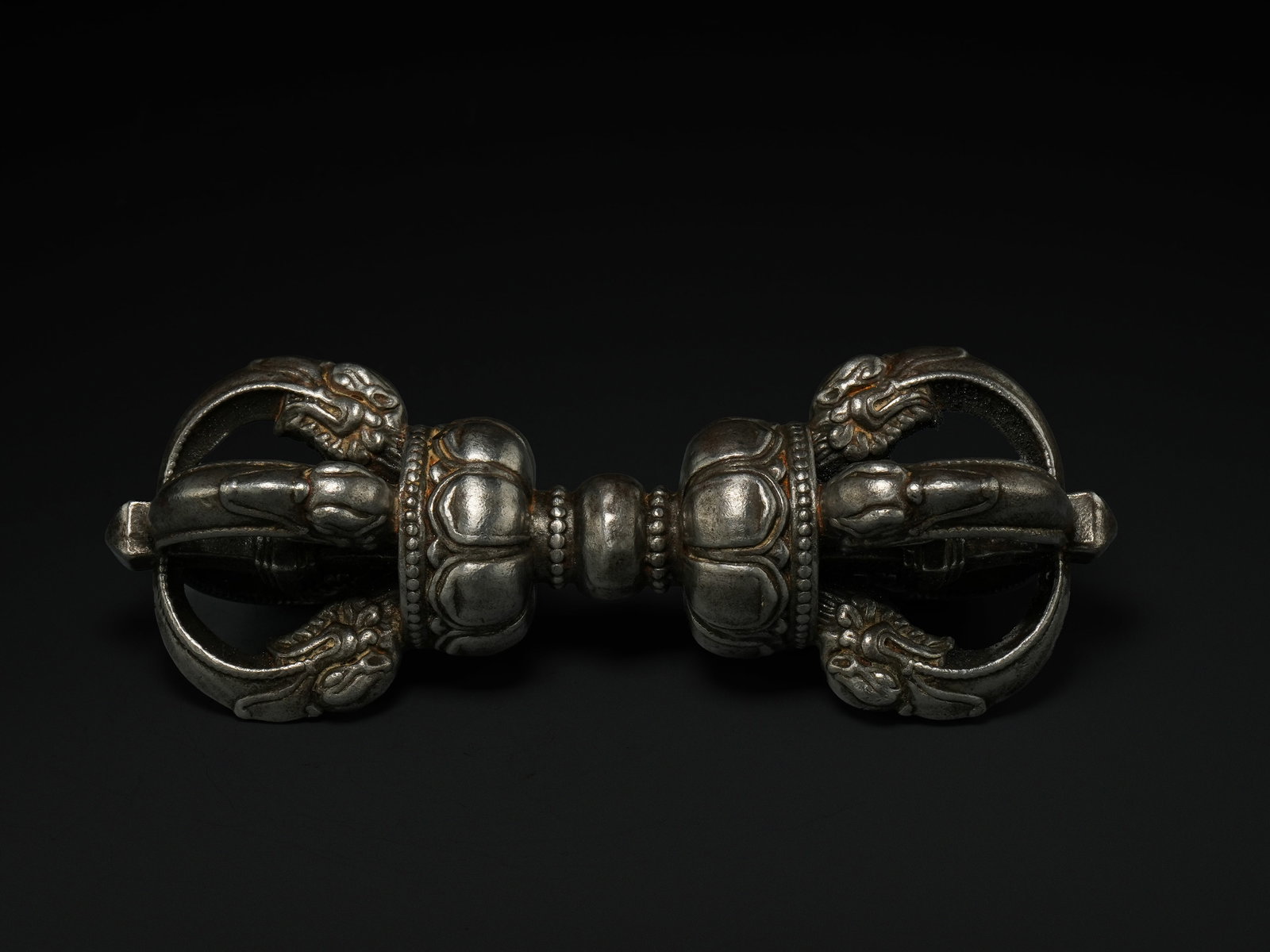 A Tibetan White Metal Vajra (Dorje), Possibly 19th Century. (1 of 3)