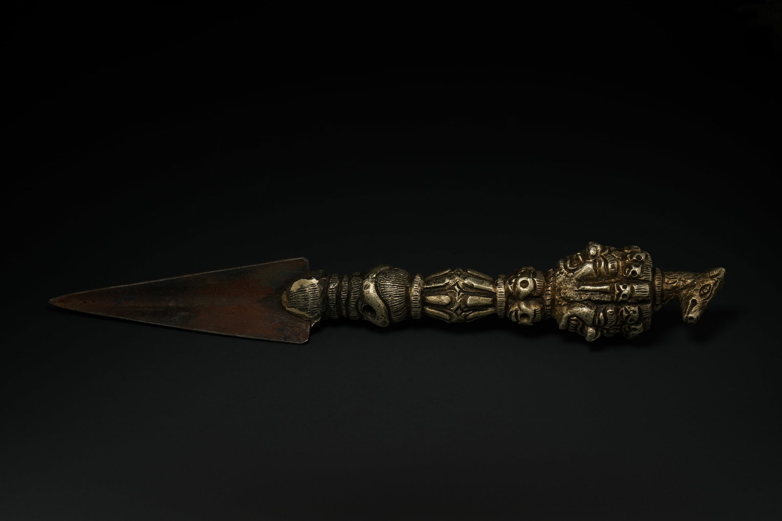 A Tibetan White Metal and Iron Phurba (Ritual Dagger). (1 of 4)