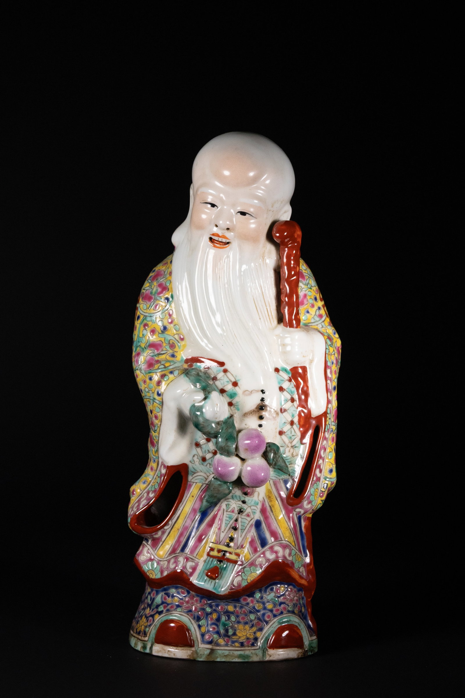 A Chinese Polychrome Porcelain Figure of Shou Lao (1 of 3)