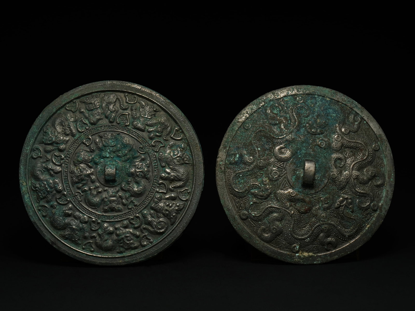 A Pair of Chinese Bronze Circular Mirrors, Possibly Han Dynasty. (1 of 2)