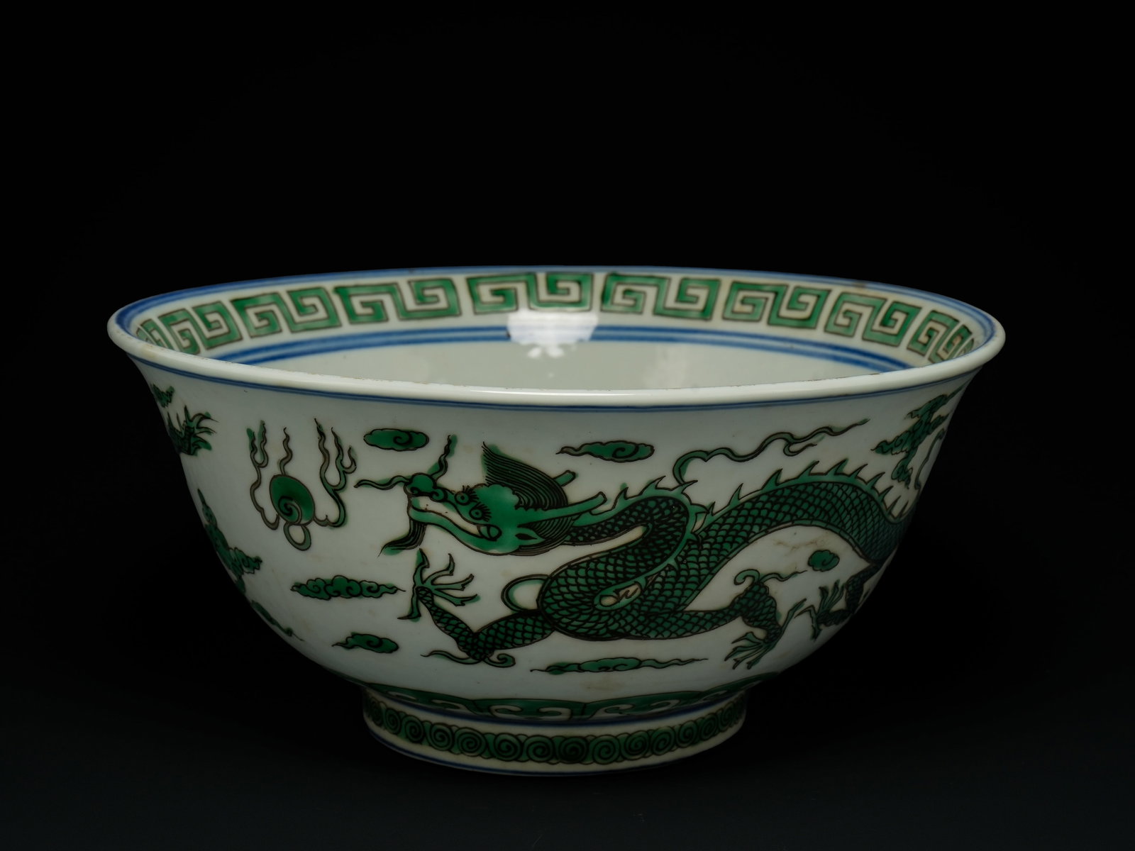 A Chinese Green-Enamelled Dragon Bowl with Greek-Key Border, Qing Mark. (1 of 4)