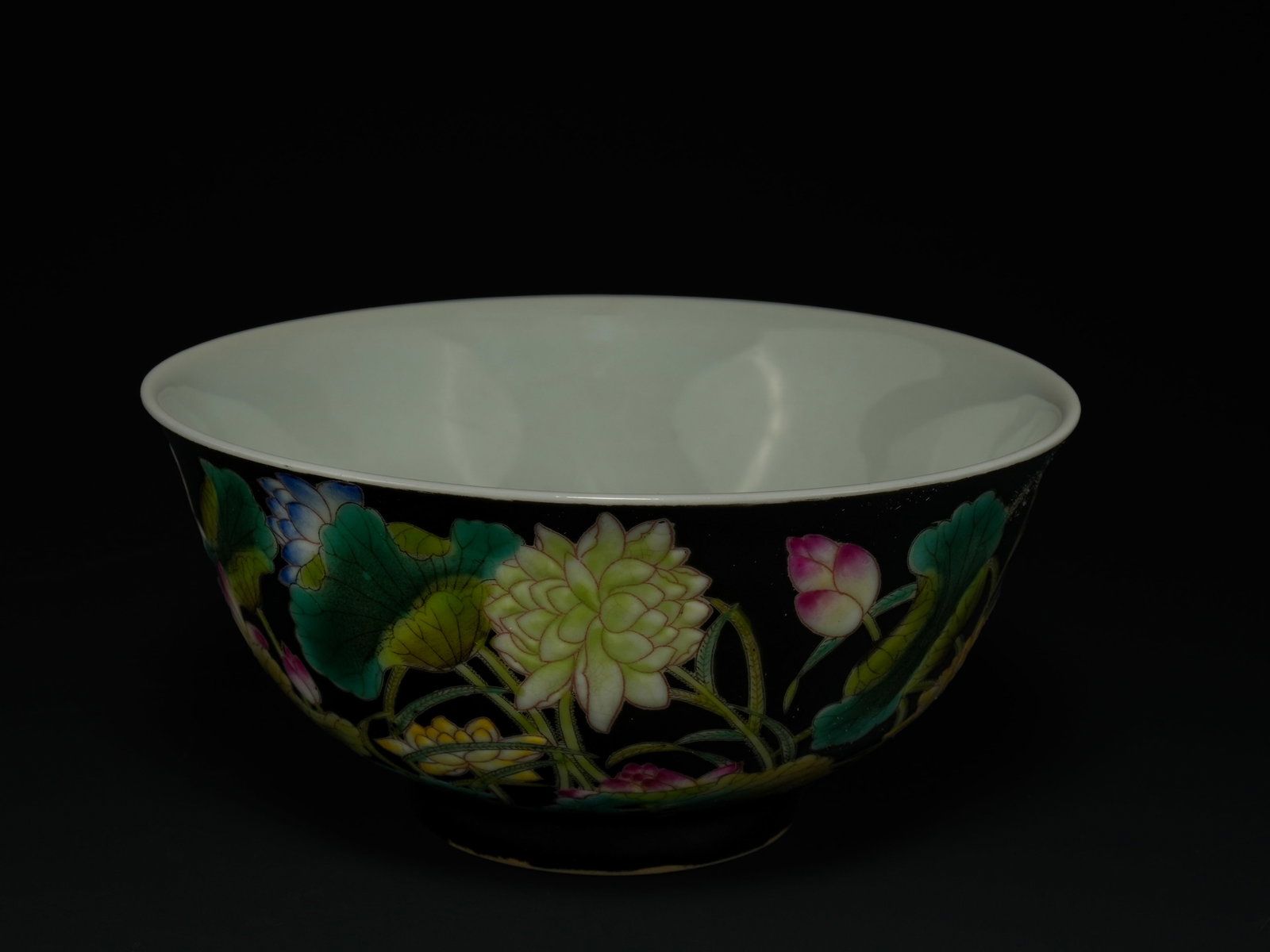 A Chinese Famille Noire Porcelain Bowl with Lotus and Foliage Decoration. (1 of 3)