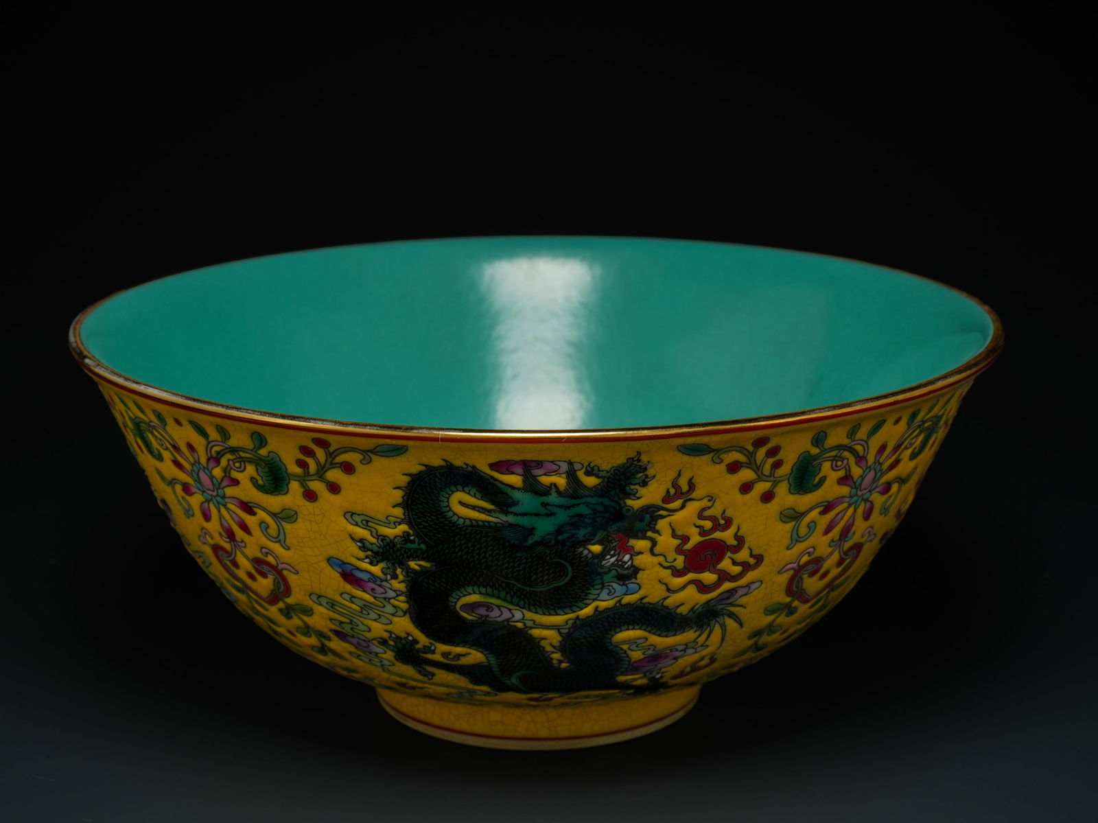 A Chinese Famille Rose Porcelain Bowl with Dragons on a Yellow Ground, Qianlong Mark (1 of 3)