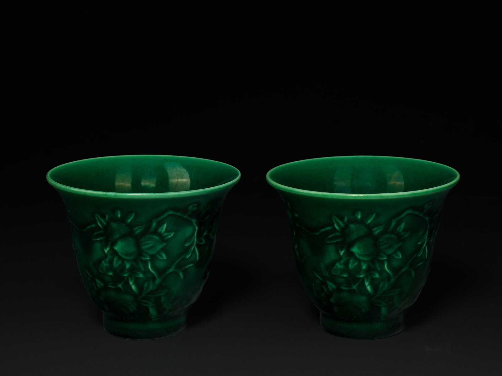 A Pair of Chinese Emerald Green Glazed Porcelain Cups with Relief Moulded Foliate Decoration. (1 of 3)