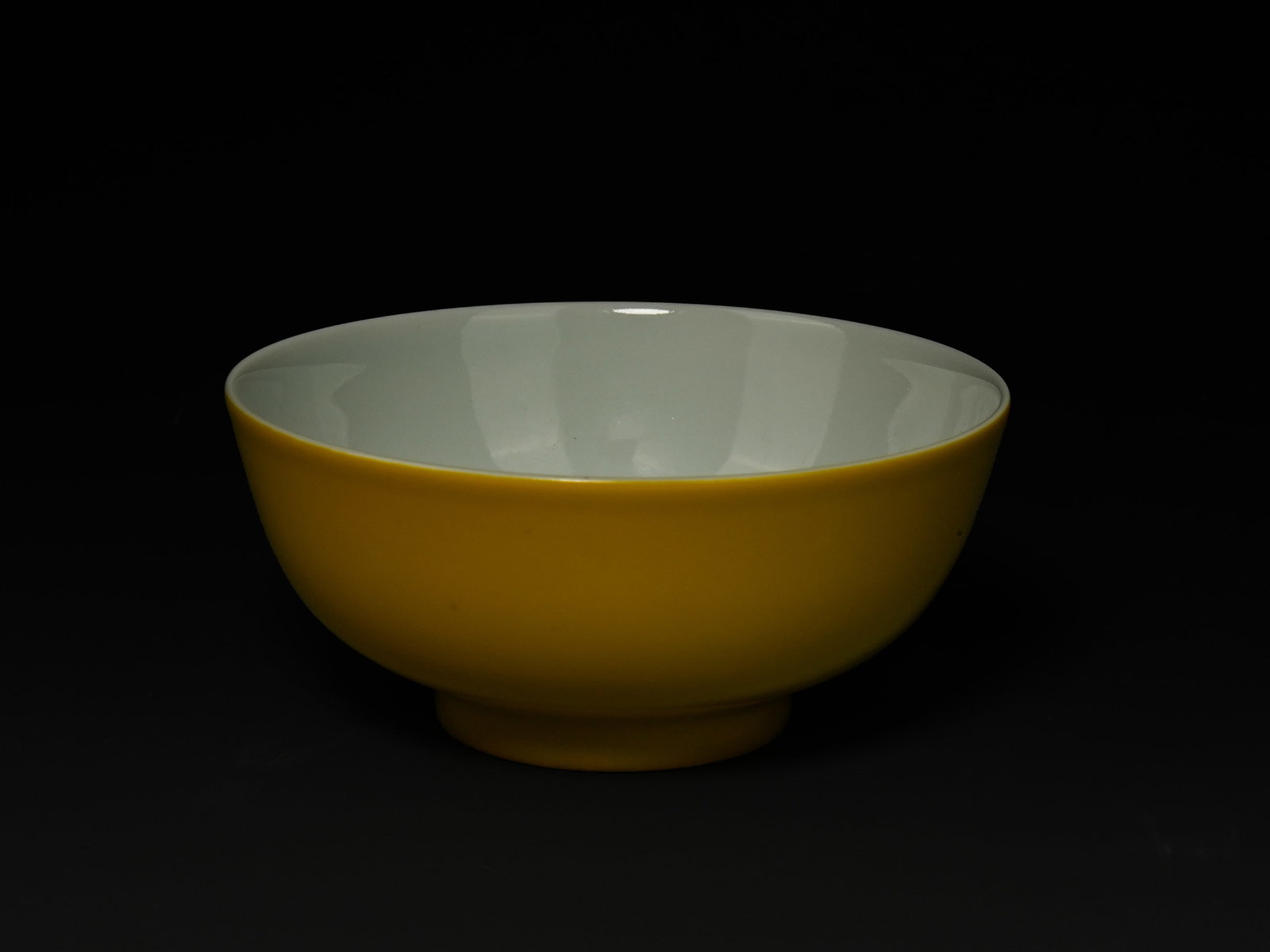 A Chinese Porcelain Yellow-Glazed Bowl with Famille Rose Peach Decoration, Yongzheng Mark. (1 of 3)
