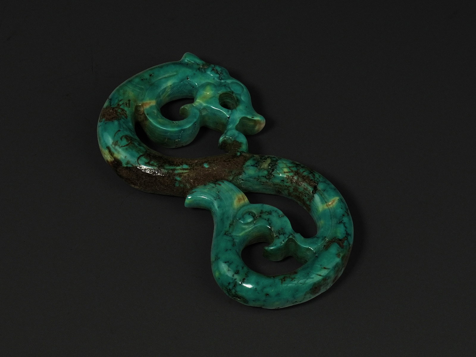 A Chinese Carved Turquoise 'S'-Shaped Double-Headed Dragon Ornament (1 of 2)