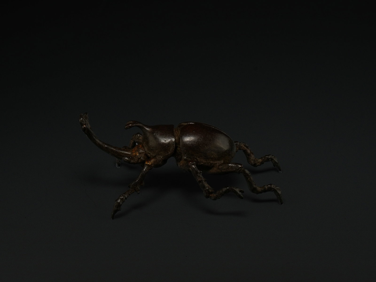 A Japanese Bronze Articulated Okimono of a Rhinoceros Beetle. (1 of 3)