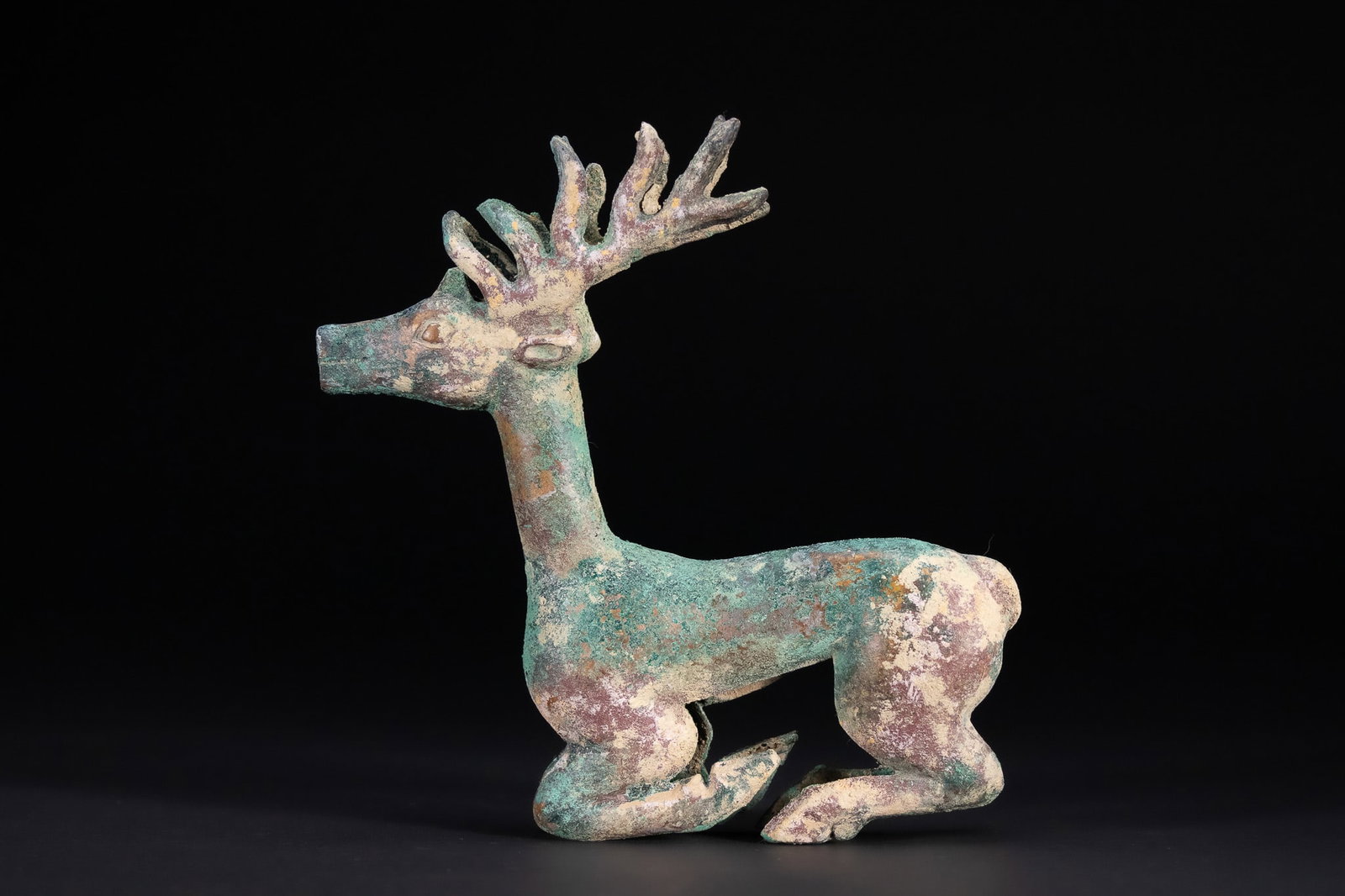 A LURISTANI BRONZE RECUMBENT STAG FIGURE, CIRCA 1000â€“700 BC. (1 of 3)