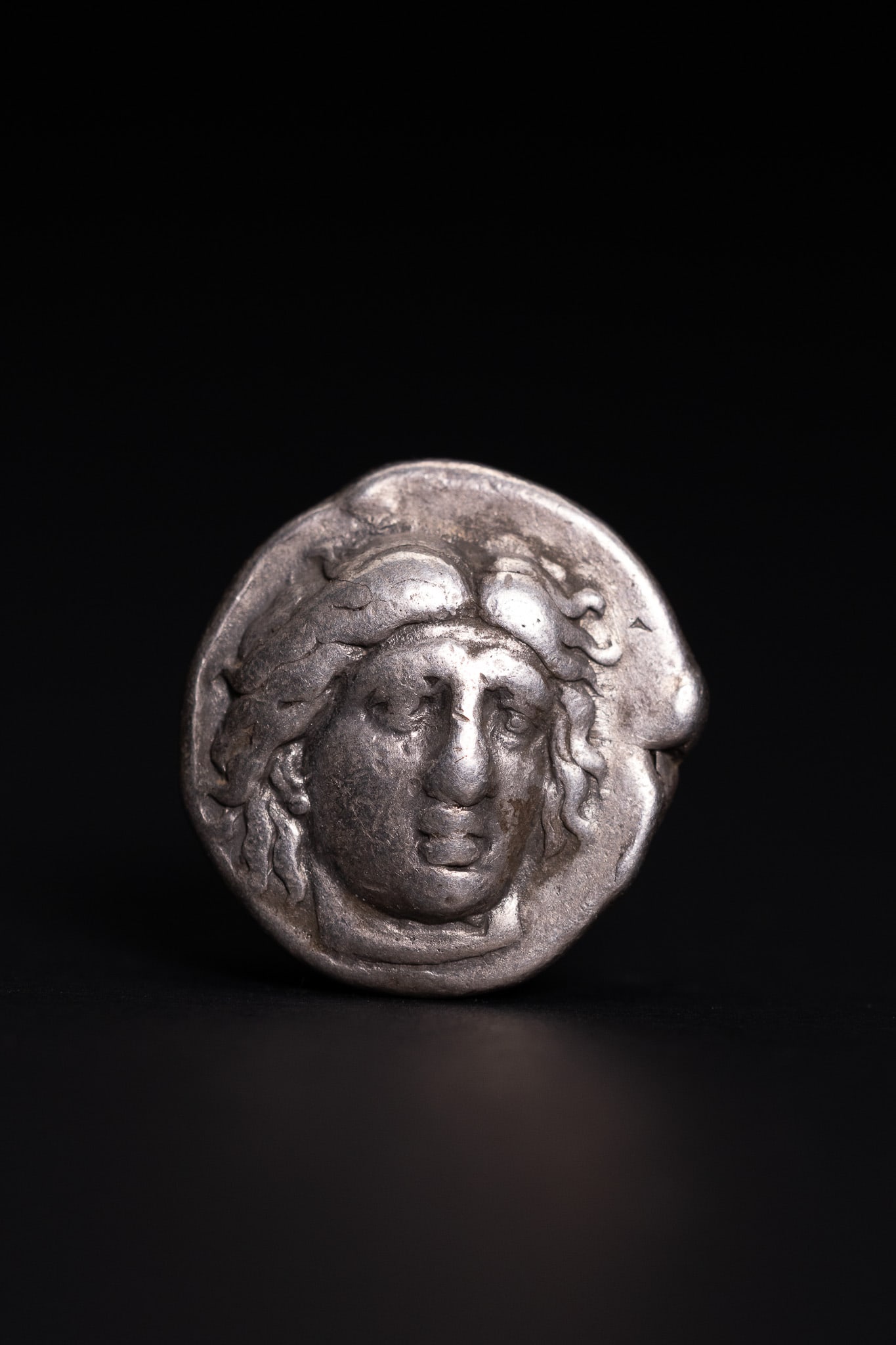 RHODIAN SILVER DRACHM WITH MEDUSA HEAD, CIRCA 3RDâ€“2ND CENTURY BC. (1 of 2)