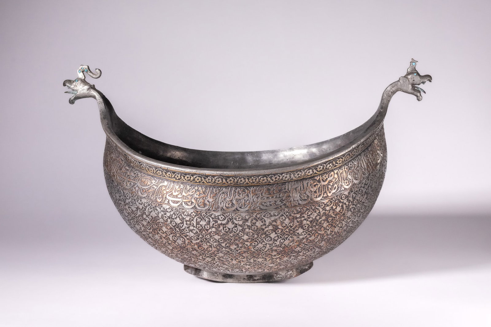 A RARE SAFAVID TINNED-COPPER KASHKUL (BEGGAR'S BOWL), PERSIA, 17TH CENTURY (1 of 7)