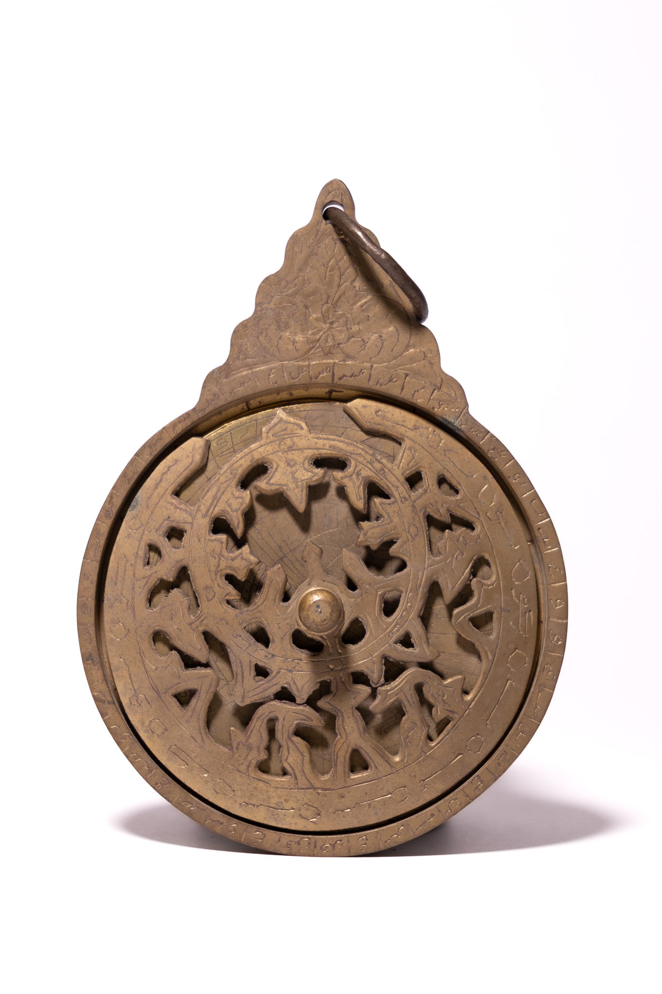 AN ISLAMIC HANGING BRASS ARABIC ASTROLABE. (1 of 4)