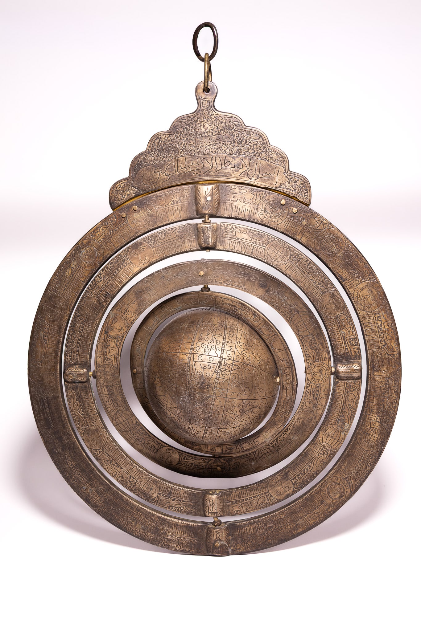 A LARGE INDO-PERSIAN ENGRAVED BRASS ARMILLARY SPHERE WITH CELESTIAL GLOBE. (1 of 9)